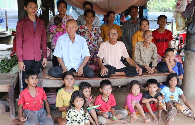 Population Census reaches remote parts of rural Cambodia, here three-generation family captured.