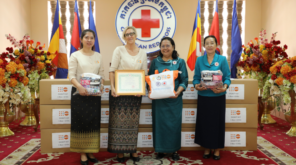 Hand over Dignity Kits to the Cambodian Red Cross.